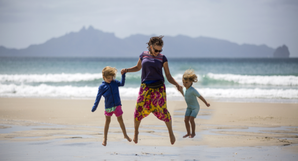 Woman with two children at beach 
