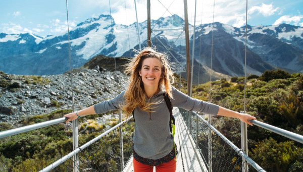 Woman on swing bridge at Aoraki Mount Cook 