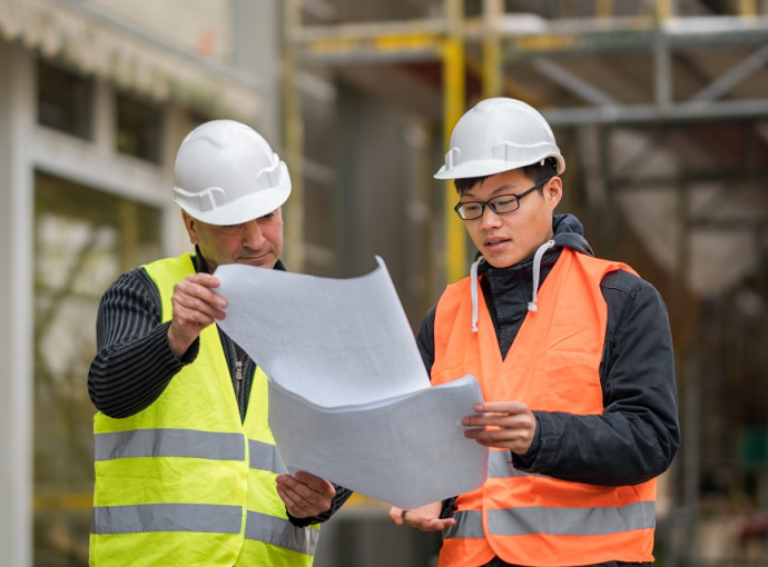 Engineers working on construction project covered by  contract works insurance 