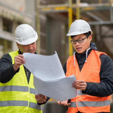 Engineers working on construction project covered by  contract works insurance 