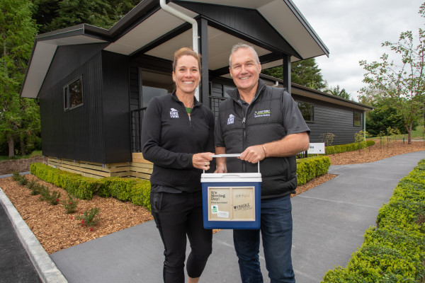 Crombie Lockwood CEO Carl O'Shea, and Michelle Impey of Save the Kiwi outisde the Crombie Lockwood Kiwi Burrow 