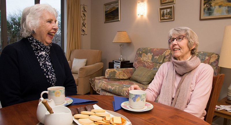 Village residents enjoy afternoon tea.