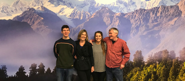 The Signlink team stand in front of one of their sign written walls