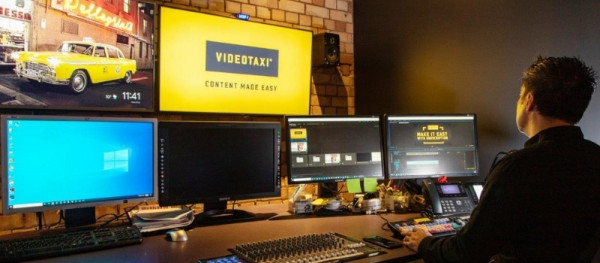 A video editor works in one of VideoTaxi's production suites