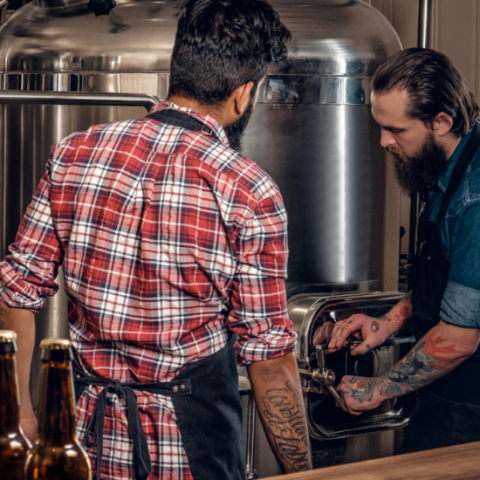  Brewery owners using machinery and equipment. 