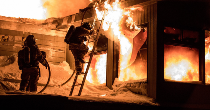 Fire fighters in burning building 