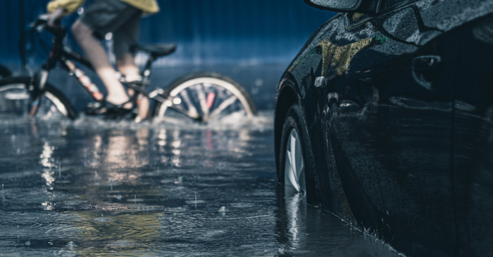 Bike and car in floodwaters