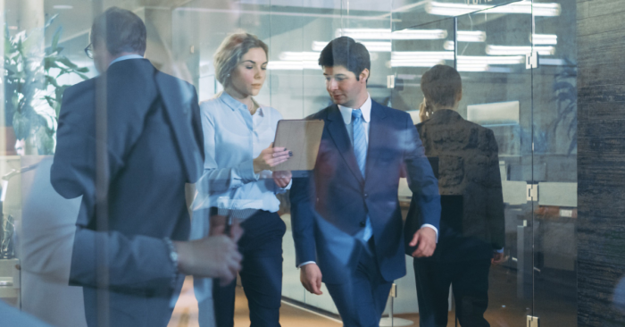 Man and woman walking in an office